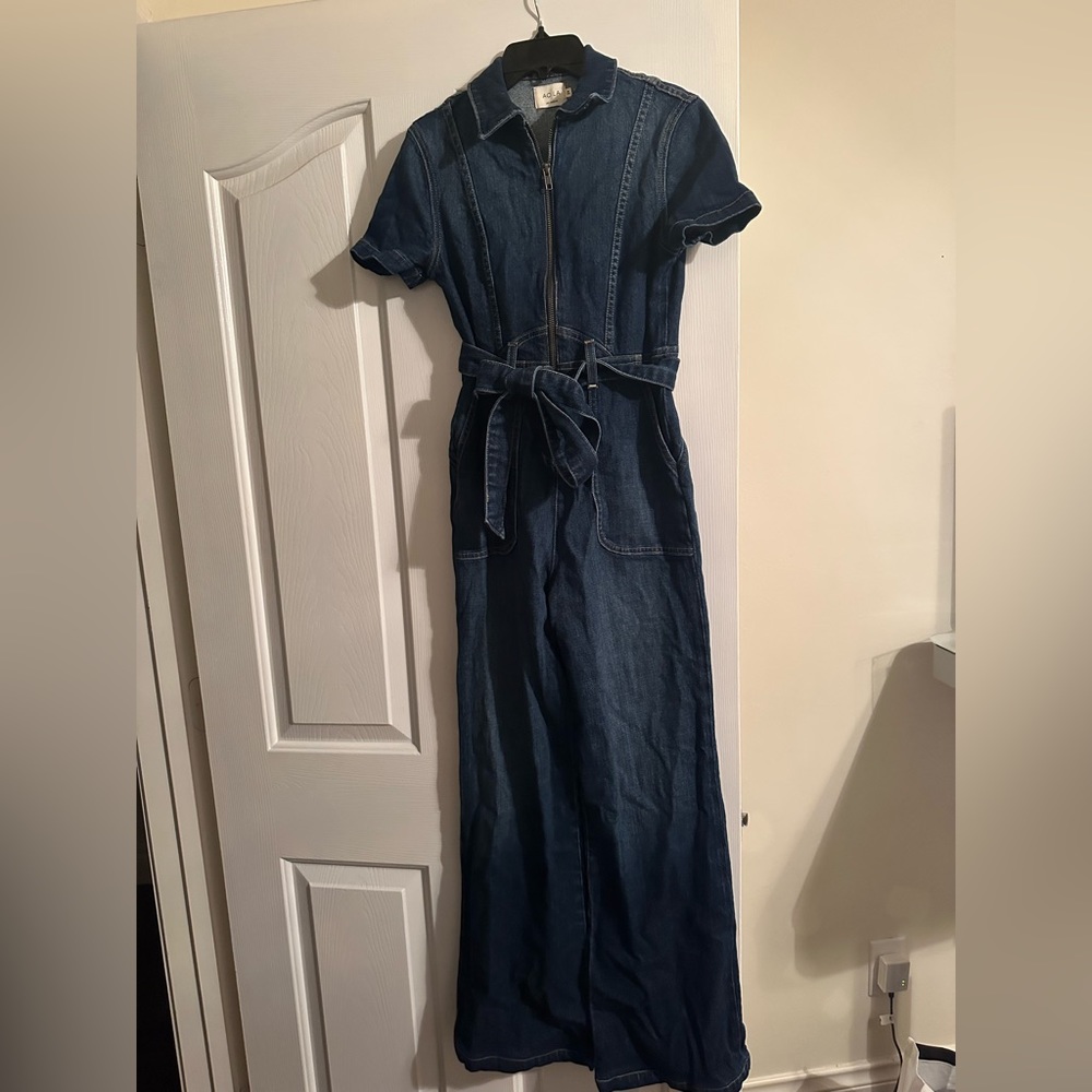 New denim jumpsuit never worn. Fits so pretty! Bell bottom
